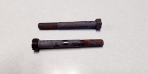 Fastener materials for extreme temperatures two heat treated parts